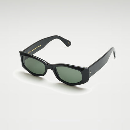 Mireye Mundaka sunglasses in black with green lenses, perspective view.