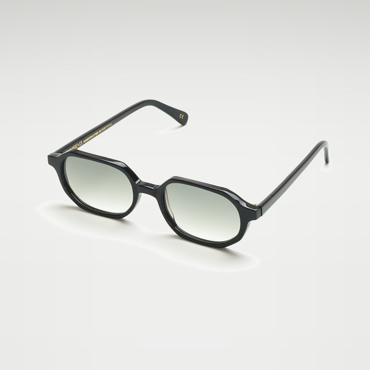 Mireye Zicattela sunglasses in black with gradient green lenses, perspective view.