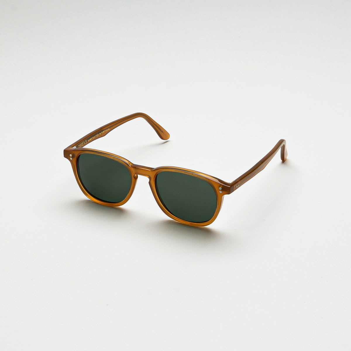 Mireye Water sunglasses in honey acetate with green Zeiss lenses, angled view.